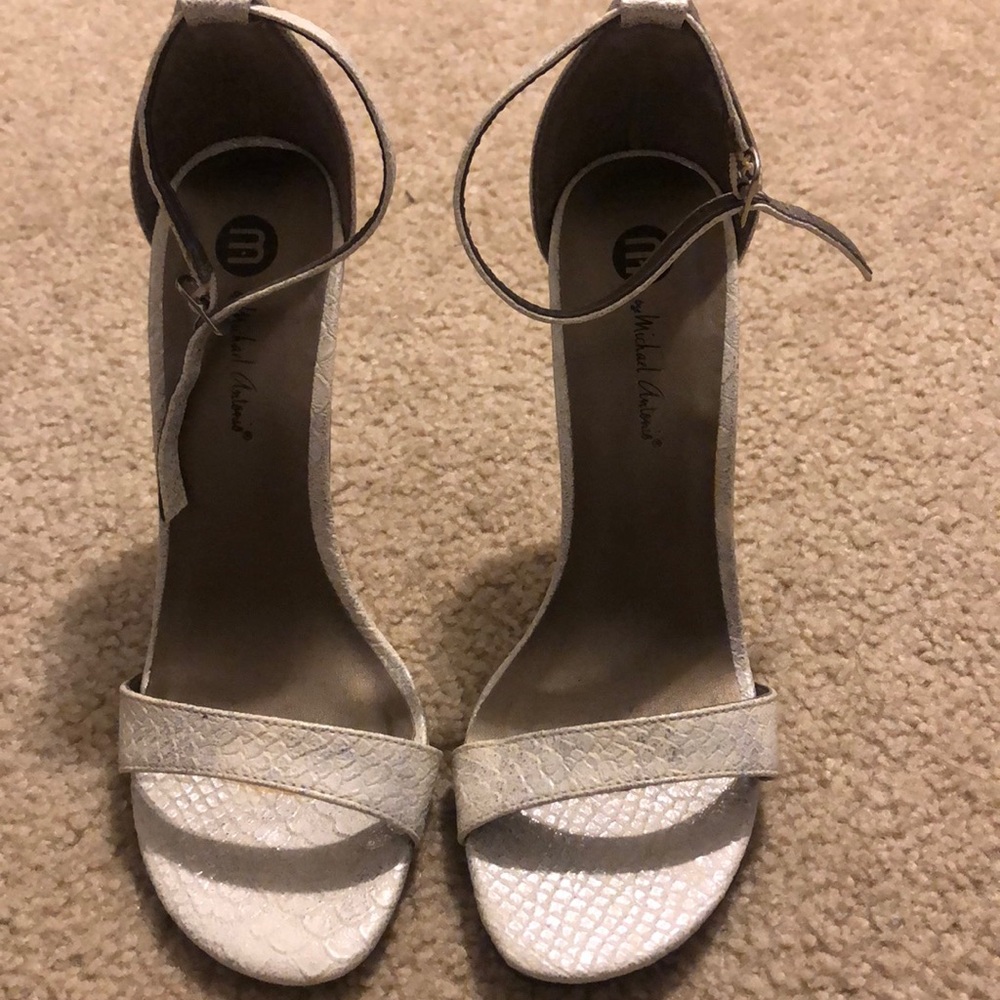White/silver snake print heels.